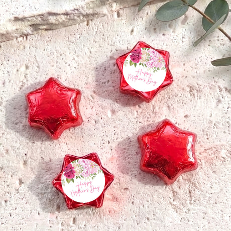 Foil-covered red chocolate stars, one with floral 'Happy Mother's Day' label