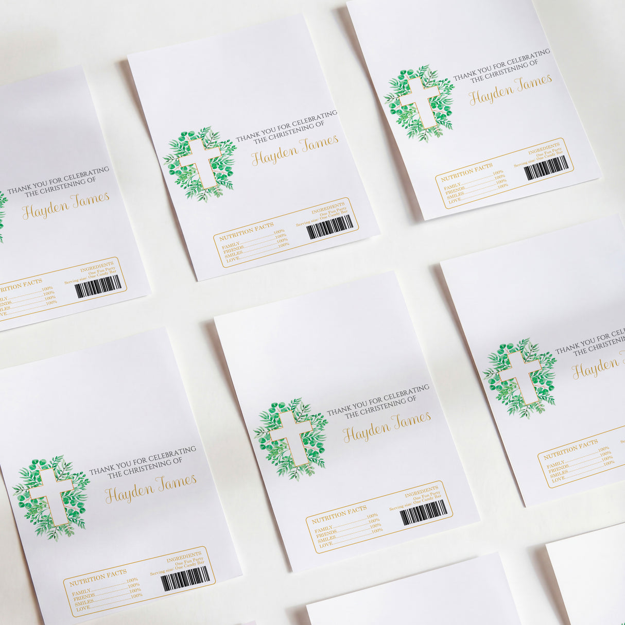 Printed chocolate wrappers, white with green cross and christening text