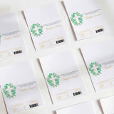 Printed chocolate wrappers, white with green cross and christening text