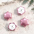 Pink foil chocolate stars with round bridal shower label and black heart design