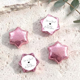 Pink foil chocolate stars with round bridal shower label and black heart design