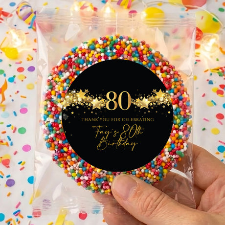Personalised 80th birthday giant freckles: black circle with gold 80 stars, sprinkle edge