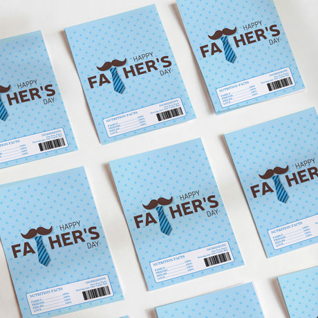 Set of blue DIY chocolate wrappers with mustache-tie Happy Father's Day and nutrition labels