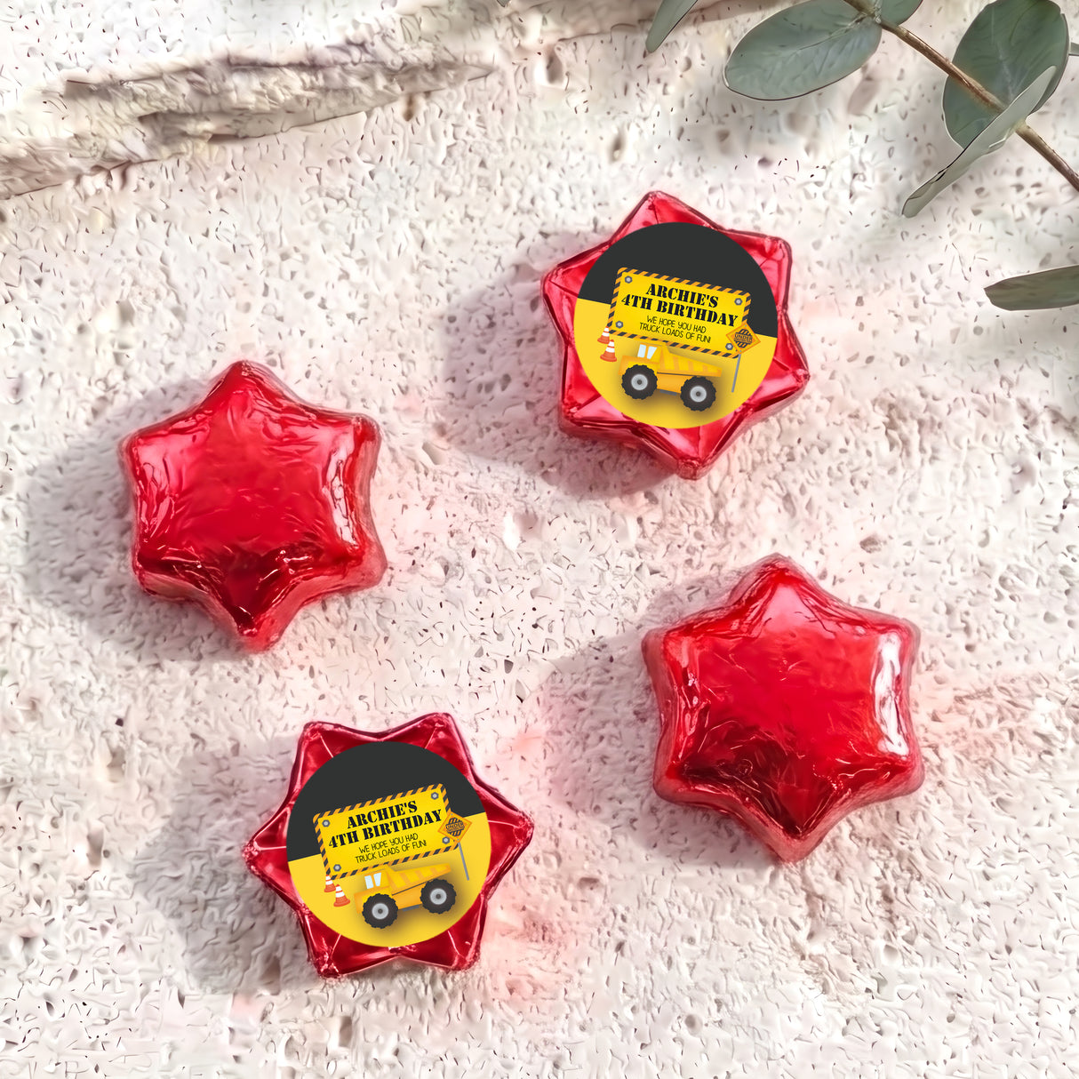 Personalised foil chocolate star with “Archie’s 4th Birthday” label, red foil