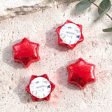 Red foil-covered chocolate stars with 'Freddie 1' label