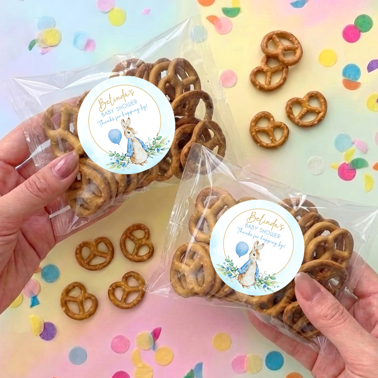 Blue baby shower personalised pretzel bag with Peter Rabbit circle label, pretzels inside