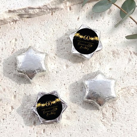 60th birthday star chocolates with silver foil-covered stars and black-and-gold 60 label