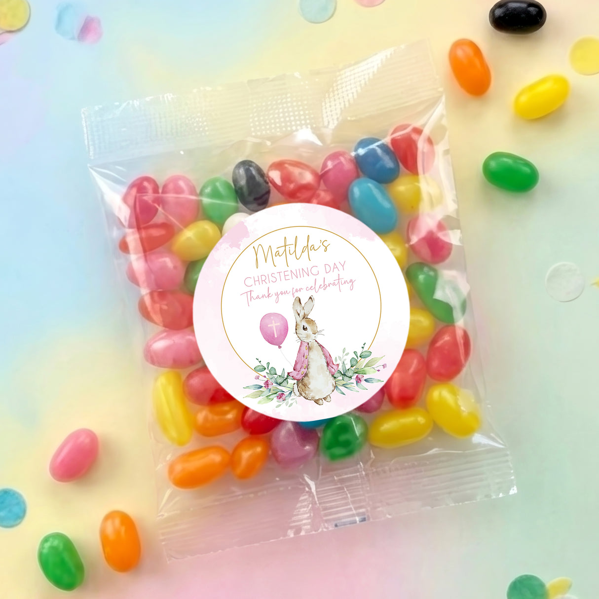 Christening jelly bean bag with round rabbit label and mixed pastel fruit candies