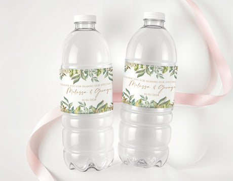 Personalised water bottle labels with green leaves and gold geometric accents on two bottles