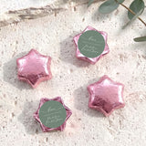 Foil-covered chocolate stars, pink with round personalized label
