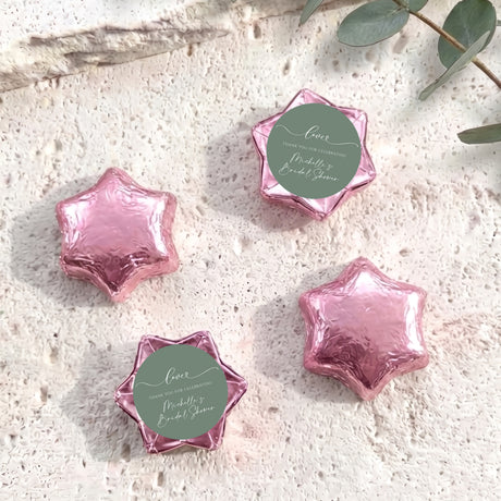 Foil-covered chocolate stars, pink with round personalized label