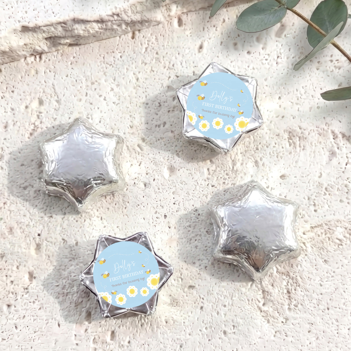 Silver foil chocolate stars with one personalised printed blue label
