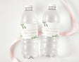 Wedding water bottle labels with green leaf greenery and gold-themed typography on clear bottles