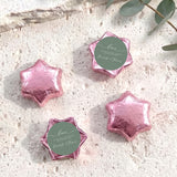 Foil-covered chocolate star favors with custom round tag, pink five-point foil stars