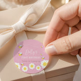 Pink round first birthday printed label with Dolly's text and bumble bee graphics