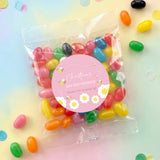 Pink bee baby shower jelly bean bag with round personalised label and colorful sweets
