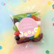 Pink bumble bee baby shower lolly bag with personalised round label and mixed sweets