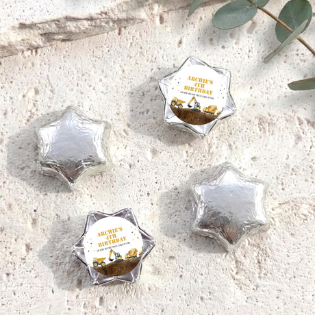 Foil-covered chocolate star sweets in dark silver, with birthday foil label
