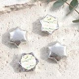 Foil-covered chocolate stars in silver tone with floral confirmation label
