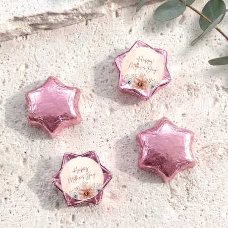 Pink foil-covered chocolate stars with a “Happy Mother’s Day” label card