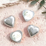 Silver foil heart chocolates with baptism cross and floral label on white center