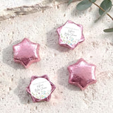 Personalised foil-covered chocolate stars, pink star-shaped chocolates with printed thank-you tags