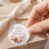 Round thank-you baby shower label with pink floral and roses; reads 'Claire's Baby Shower'.