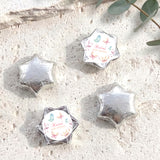 Silver foil covered chocolate star set with personalized baby shower card labels.