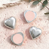 Foil-covered chocolate hearts in silver foil with cross and personal message