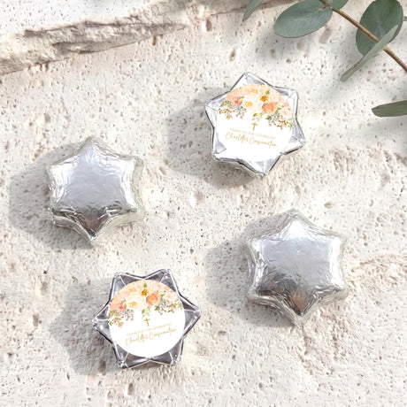 Foil-covered star chocolates with silver foil and a white floral name label