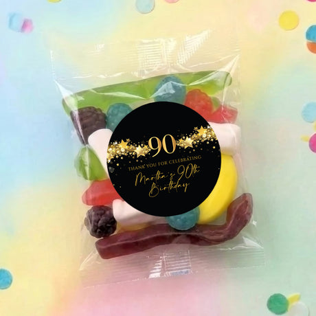 Personalised 90th birthday lolly bag with clear wrapper, black round label with gold stars