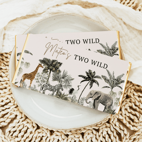 Safari-themed “Two Wild” custom chocolate bar wrapper with giraffe, zebra, elephant, and palms
