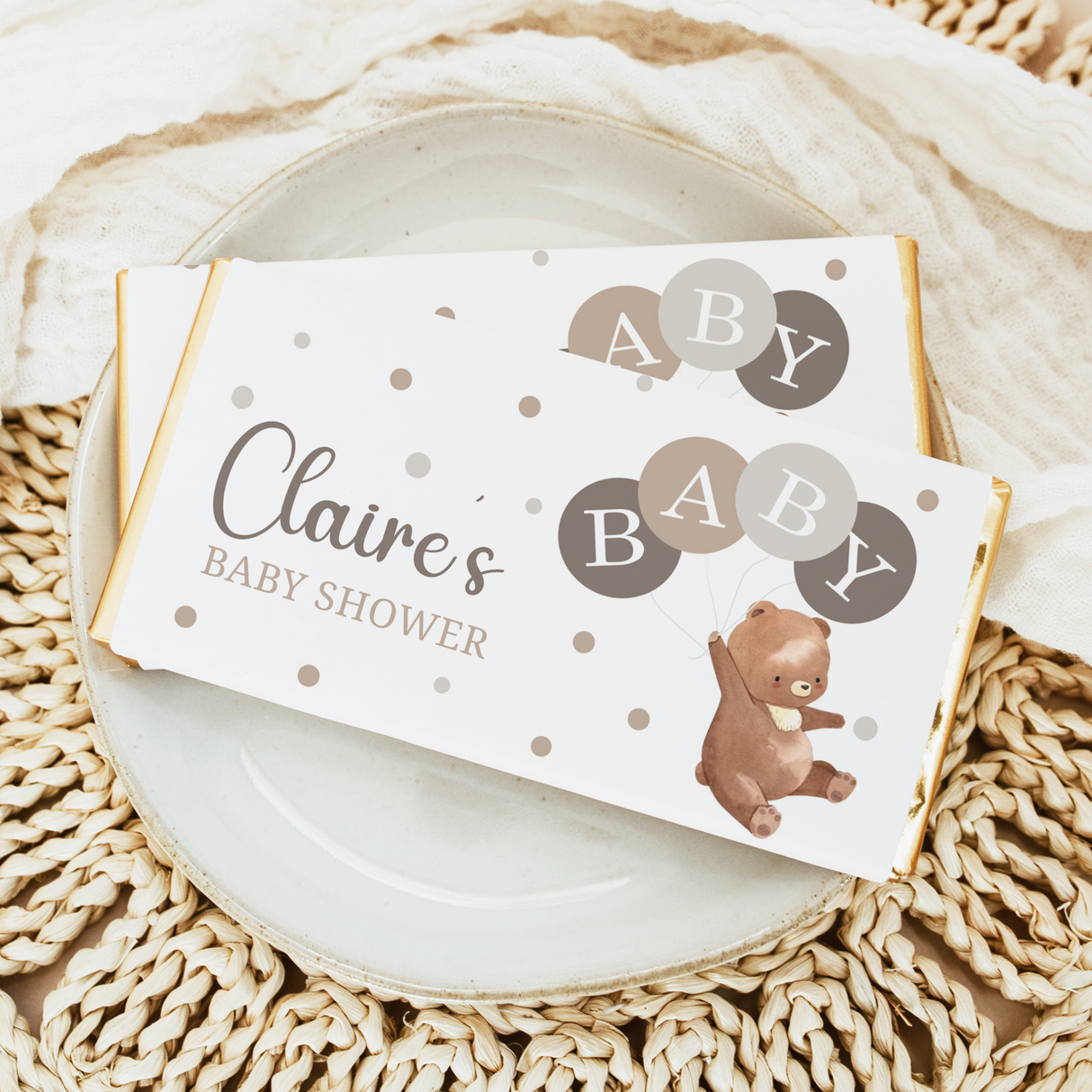 Baby shower chocolate bar wrapper with Claire's name, bear, balloons, and polka dots