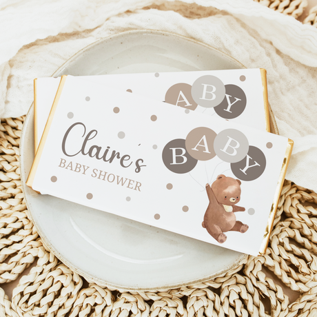 Baby shower chocolate bar wrapper with Claire's name, bear, balloons, and polka dots