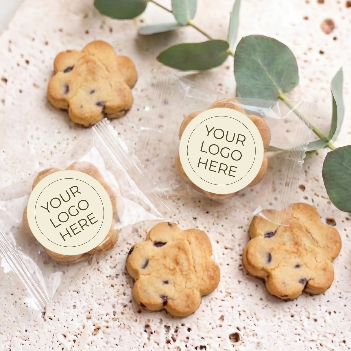 Choc chip cookies with two round Your Logo Here labels on clear wrappers