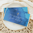 Blue baptism chocolate bars with gold crosses and thank-you text, custom name in white script