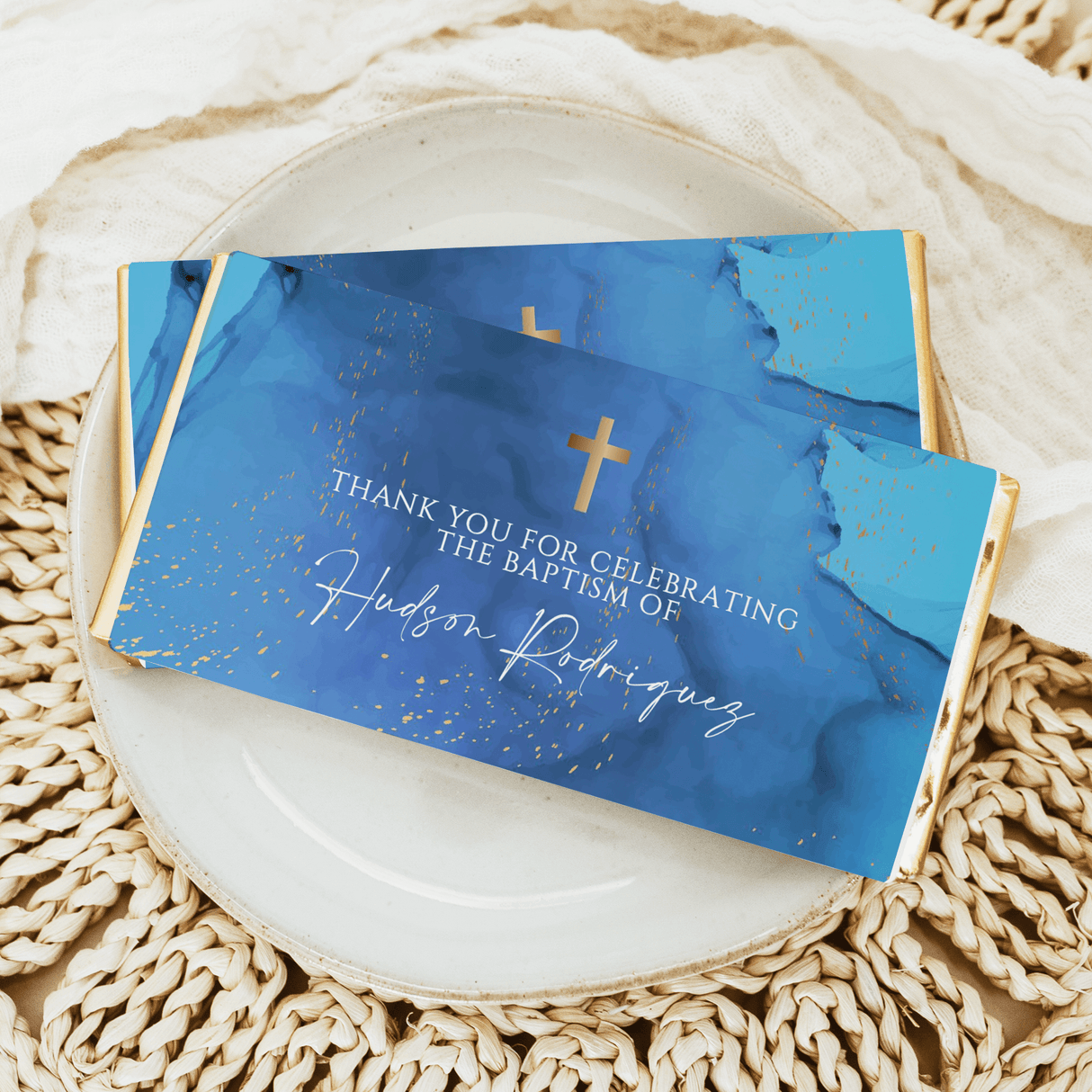 Blue baptism chocolate bars with gold crosses and thank-you text, custom name in white script