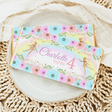 Chocolate bar wrapper with pastel florals, fairies and “Charlotte turns 4” text