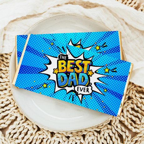 Blue comic chocolate bar wrapper with "The Best Dad Ever" and starburst design