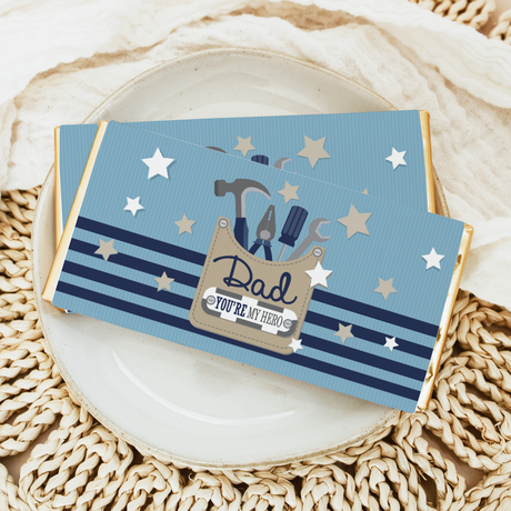 Dad tool-themed chocolate bars on a plate, blue star wrappers with tool icons