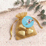 Gold heart chocolates in sheer golden organza drawstring gift bag with round label