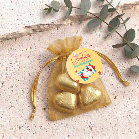 Gold metallic heart chocolates in sheer gold organza gift bag with drawstring