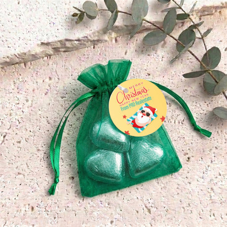 Green metallic heart chocolates in sheer green organza gift bag with drawstring