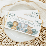 Happy animals first birthday chocolate bar wrappers with lion, elephant, and thank-you text
