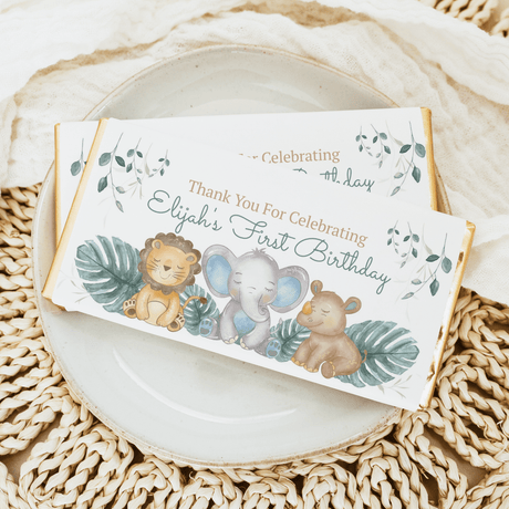 Happy animals first birthday chocolate bar wrappers with lion, elephant, and thank-you text
