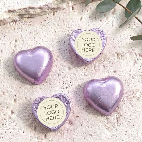 Purple foil-covered chocolate hearts with “YOUR LOGO HERE” label