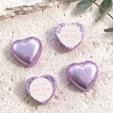 Purple foil-covered heart chocolates with “Custom Design” card labels