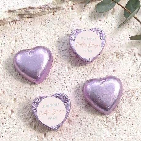 Purple foil-covered heart chocolates with “Custom Design” card labels