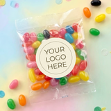 Jelly bean bag with “YOUR LOGO HERE” label, filled with colorful jelly beans