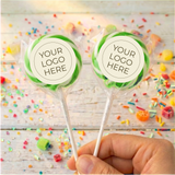 Green swirled lollipops with “Your Logo Here” labels on white sticks
